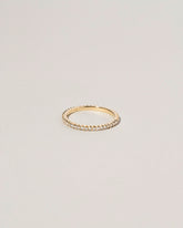 Gold White Diamond Gear Edge Band on light color background.