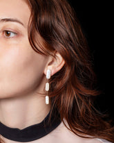 Pelias Earrings on model.
