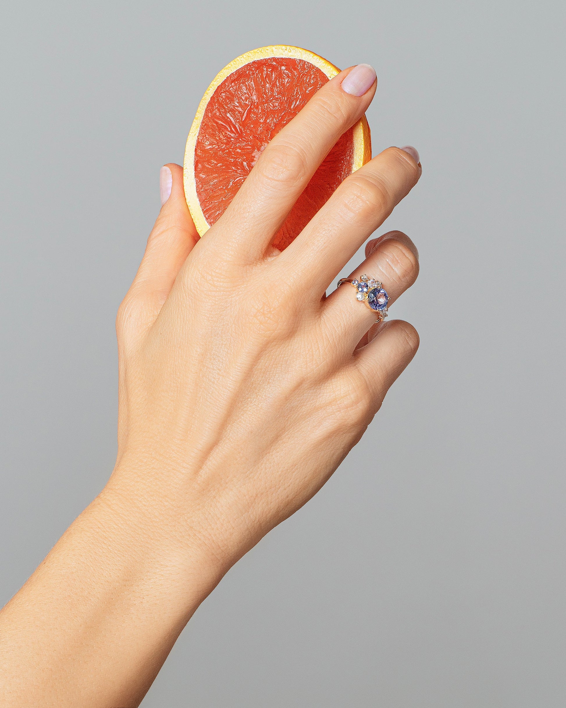 Vega Ring - Bicolor Sapphire on model.