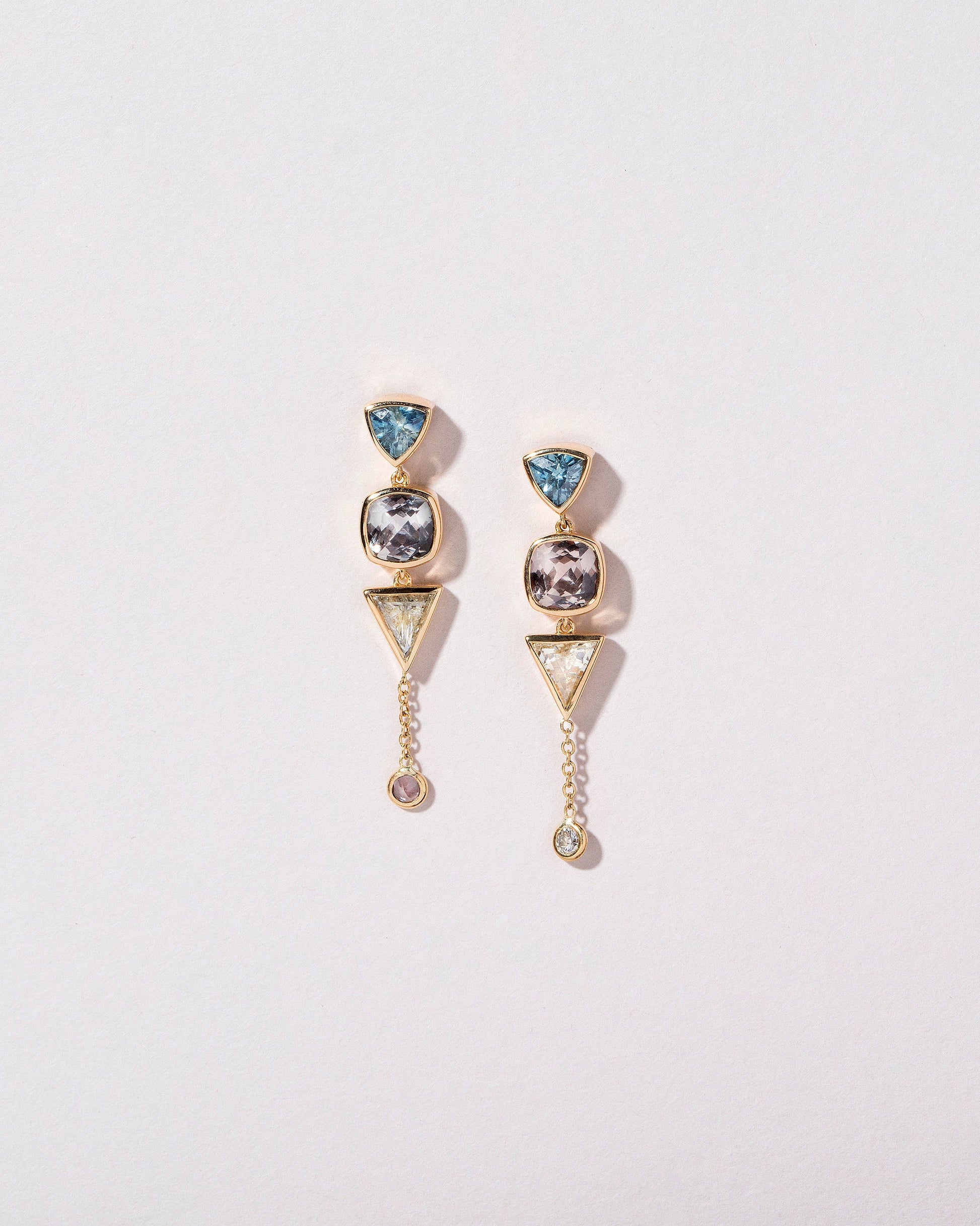 Trillion Cut Sapphire Cluster Earrings - Final Sale on light color background.