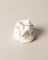 Eleonor Boström White Dog Pile on light color background.