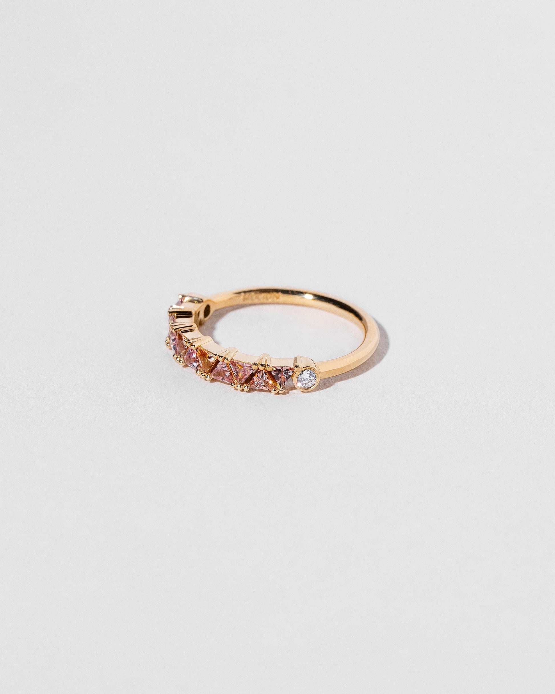 Eleven Trillion Ring - Peach Sapphire on light color background.