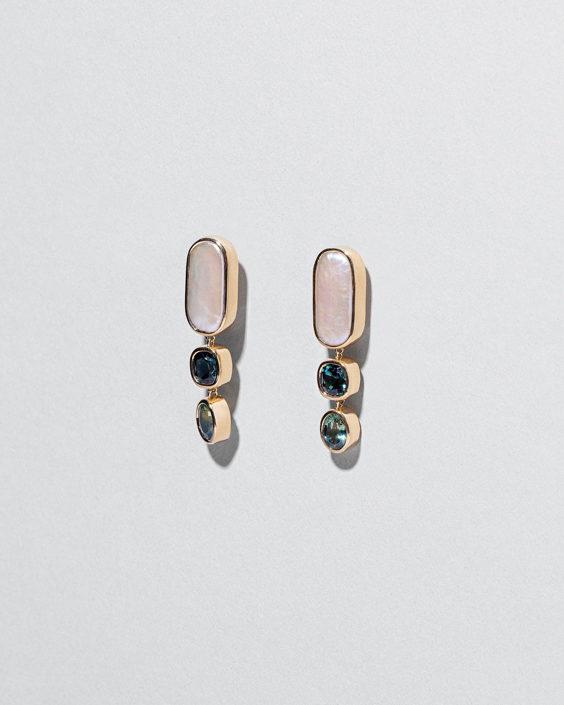 Luster Earrings on light color background.