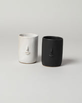 Group of  Rami Kim Mini Face Tumbler on light color background.