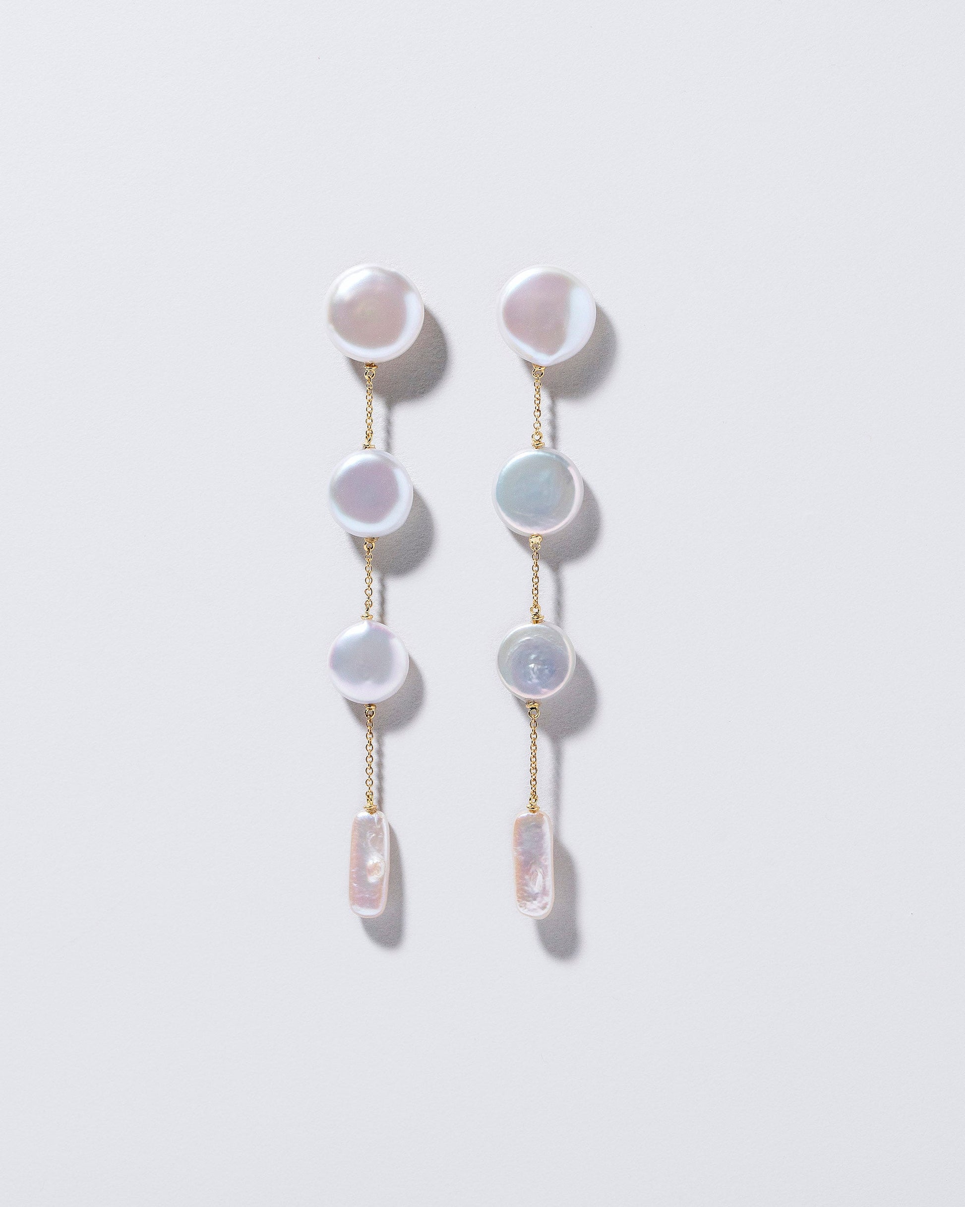 Antaeus Earrings on light color background.