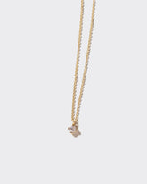 Brille Necklace on light color background.