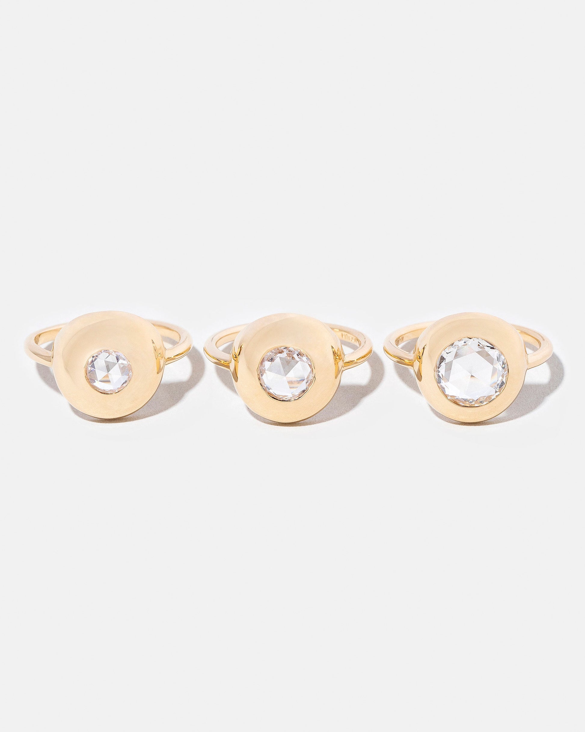 Petite Exposition Ring on light color background.