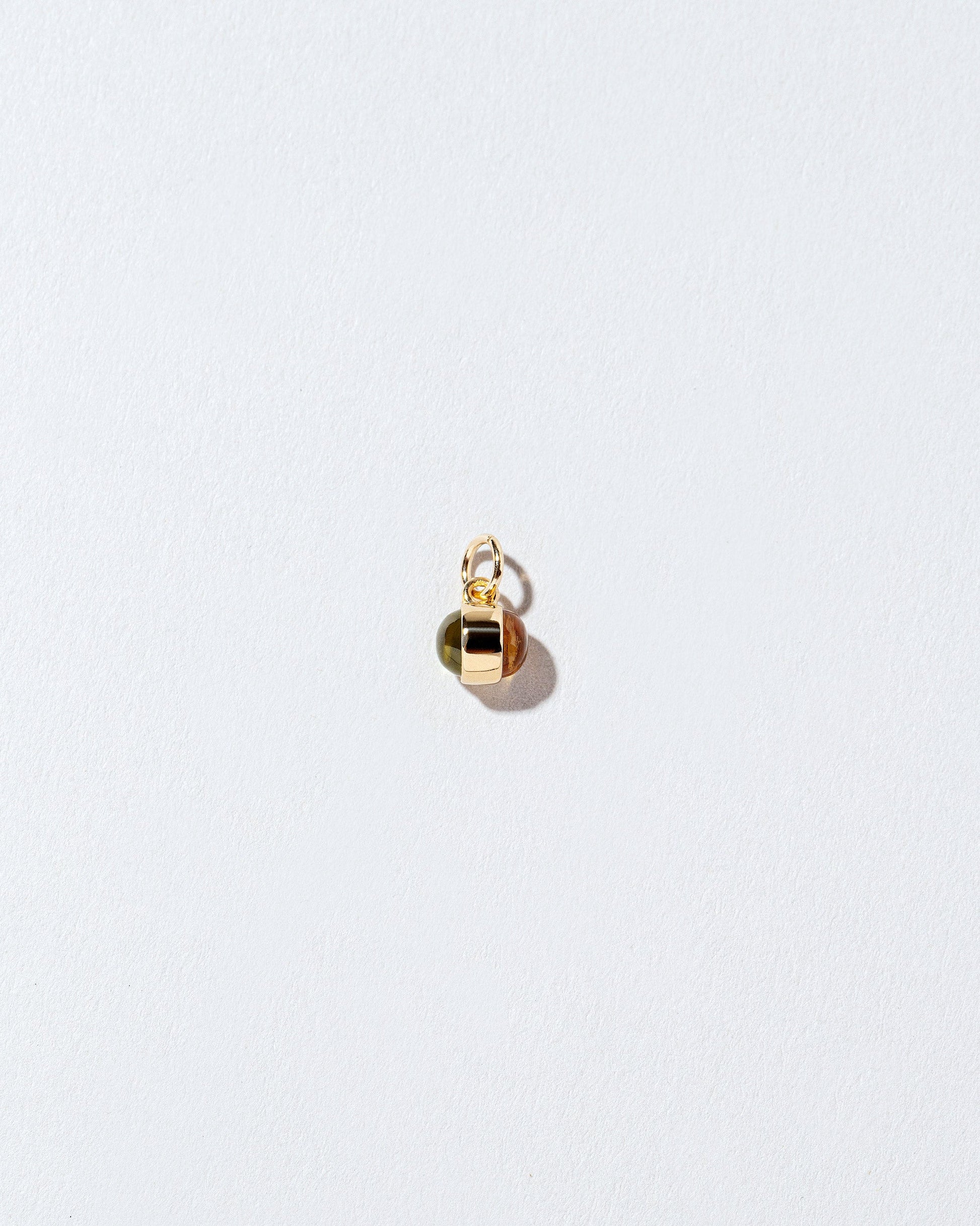 Birthstone Charm on light color background.