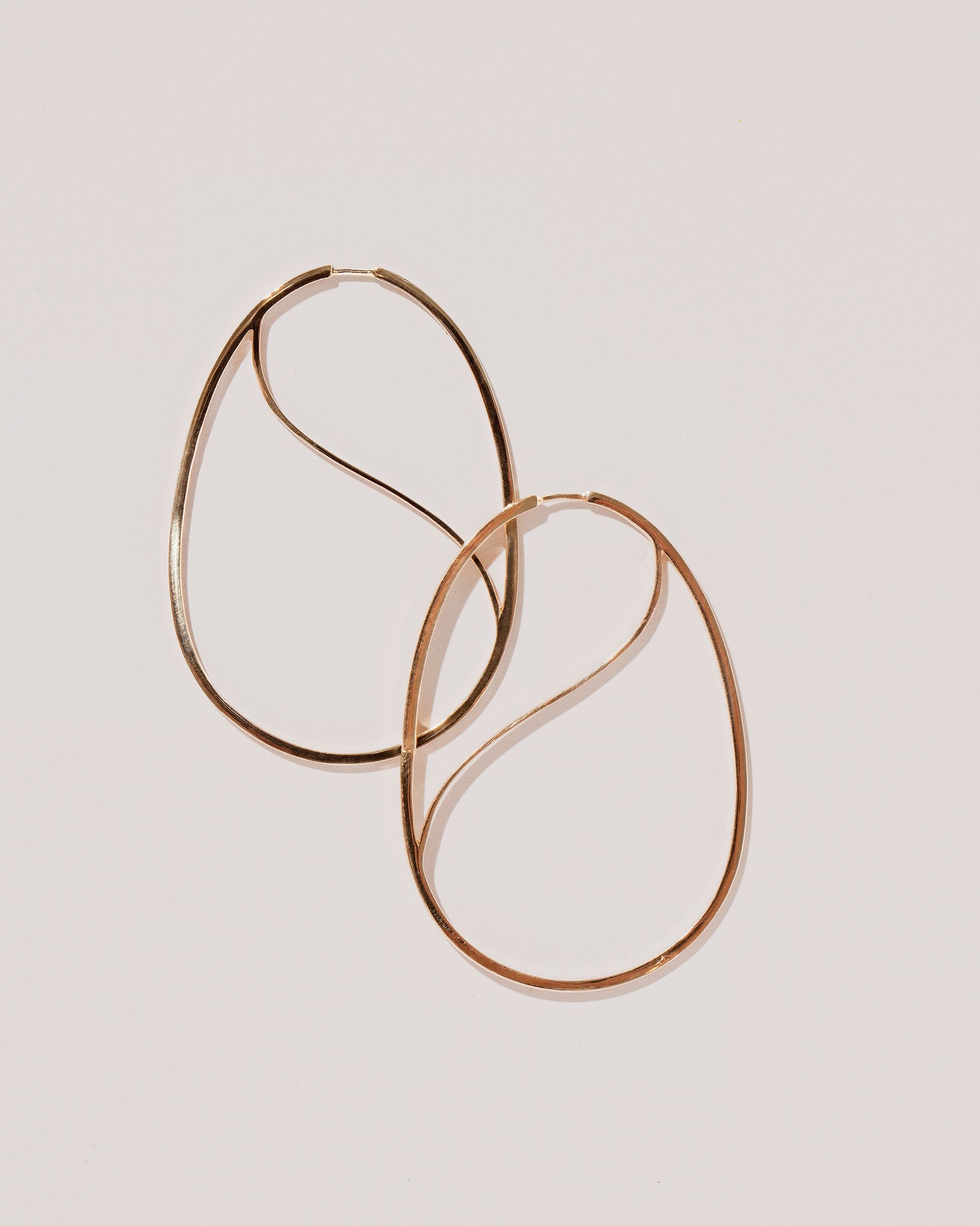 Snake Egg Hoops on light color background.