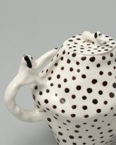 Closeup detail of the Eleonor Boström Spotty Coffee Pot Dogs on light color background.