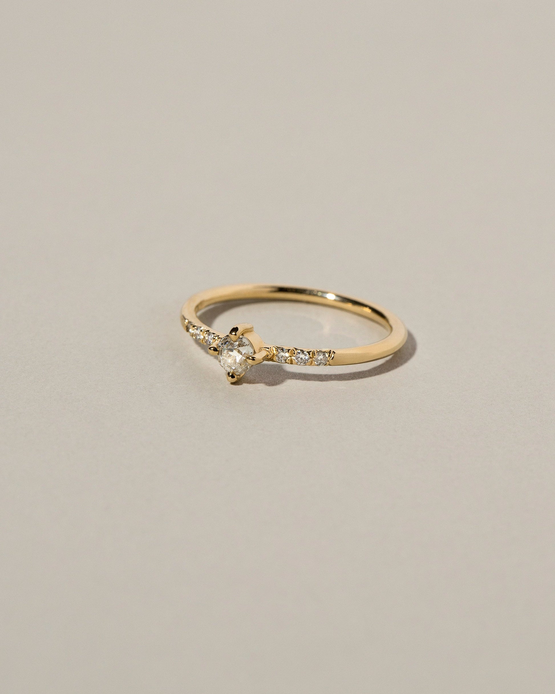 Mini Compass Rose Ring on light color background.