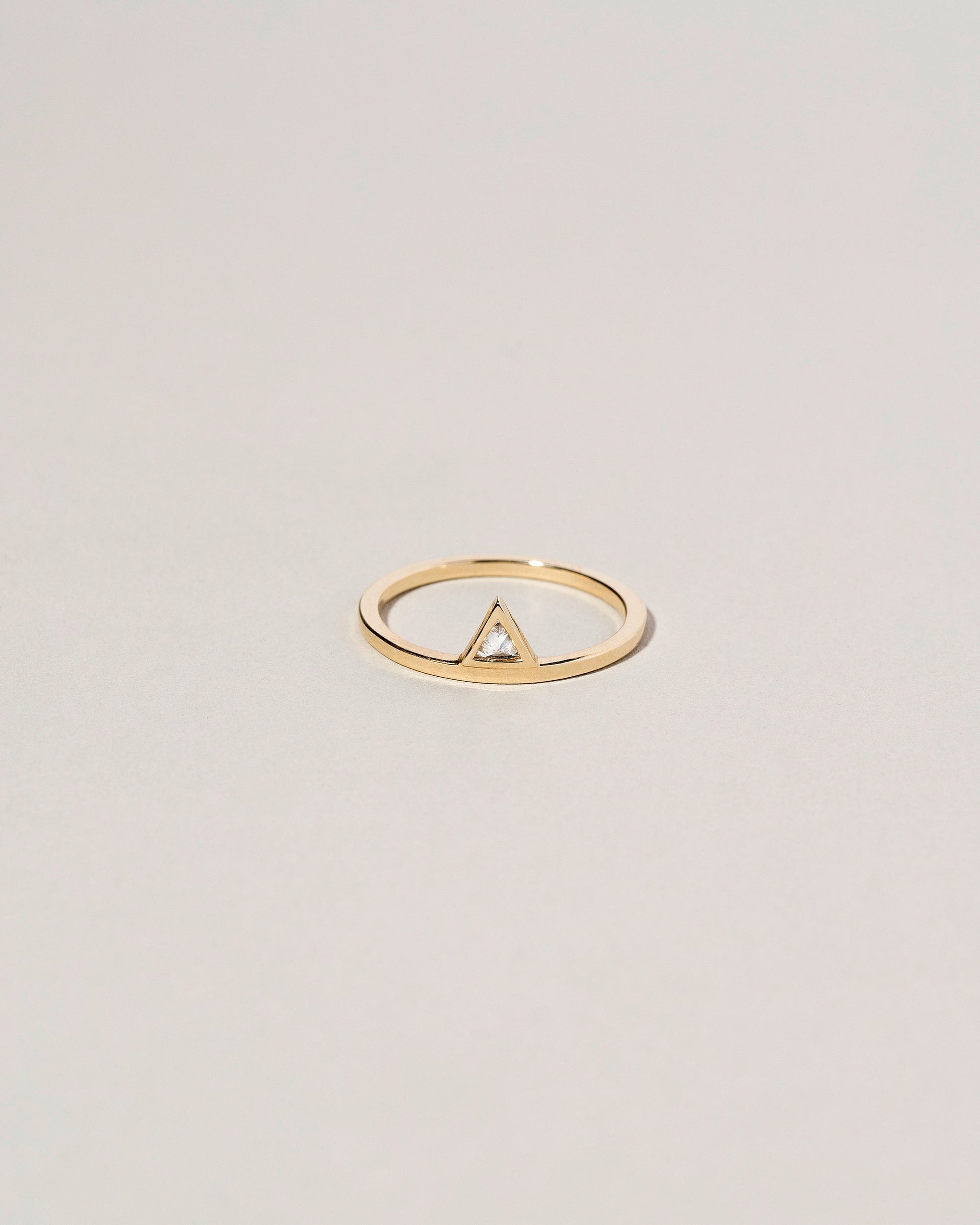 Stacked Ring - Triangle on light color background.