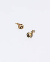 Clams Casino Charm on light color background.