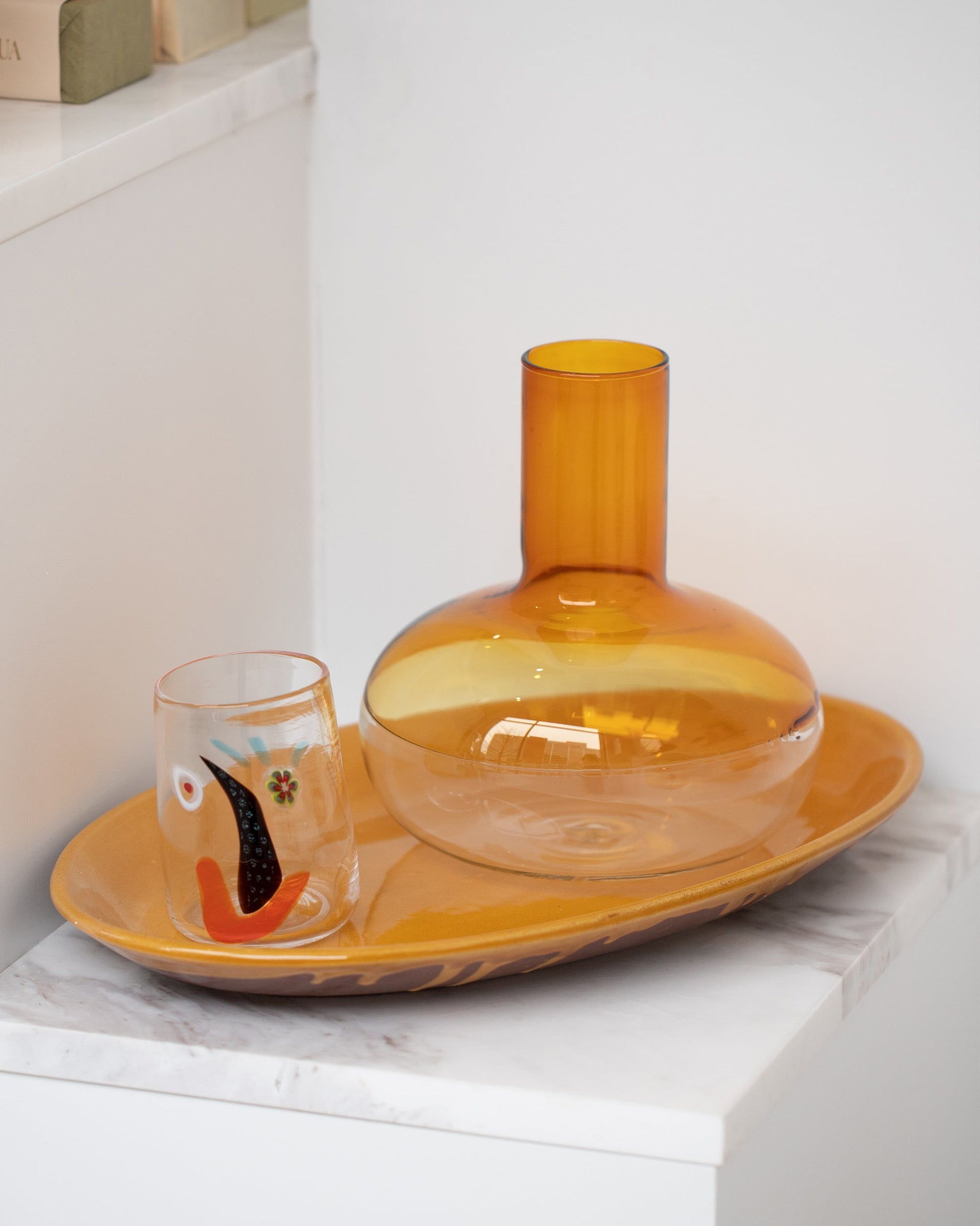 Styled image featuring Ichendorf Milano Alchemy Decanter and FACEVESSEL Face Glass.