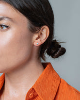 Turquoise Half Moon Stud Earring Single on model.