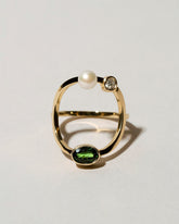Trilogy Ring - Tsavorite on light color background.