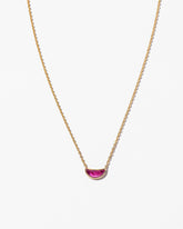 Desire Necklace on light color background.