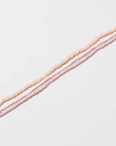 Multi Strand Seed Pearl Choker on light color background.