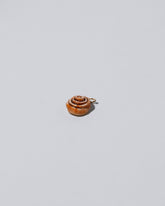 Cinnamon Roll Charm - Enamel  on light colored background