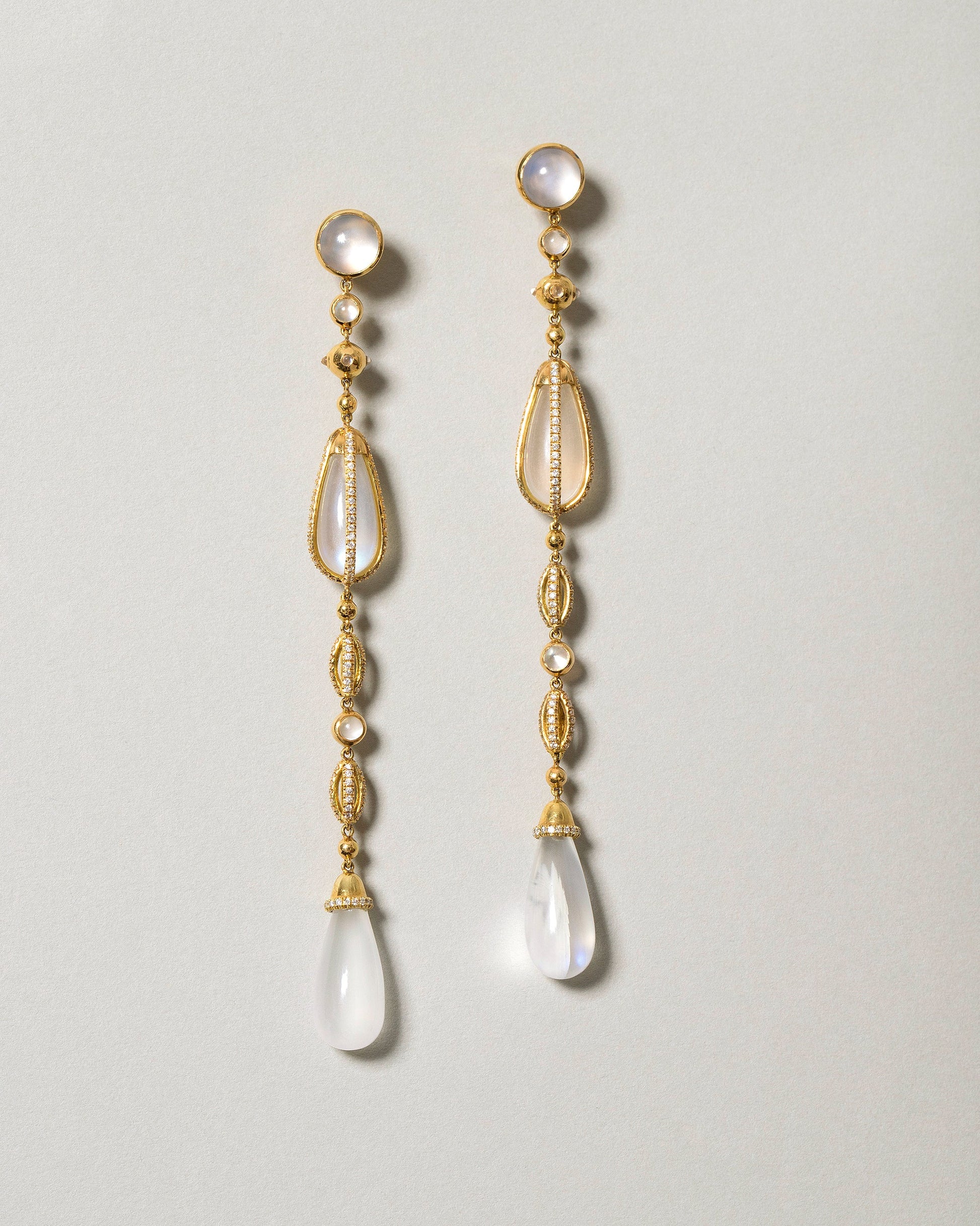 The Future Moonstone Drop Earrings on light color background.