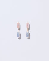  Neleus Earrings on light color background.