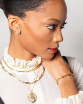 Full White Diamond Left Spiral Stud Earring Single, Grand Duality Medallion Pendant, Infinite Spiral Bracelet and Infinite Spiral Necklaces on model.