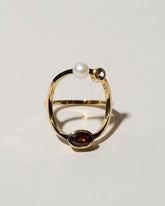 Trilogy Ring - Garnet on light color background.