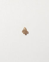 Button Mushroom Charm on light color background.