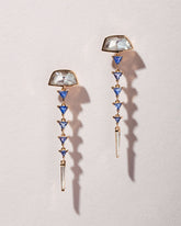Abundance Earrings on light color background.