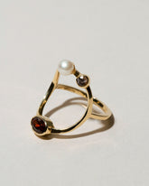 Trilogy Ring - Garnet on light color background.