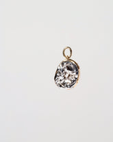 Poppy Seed Bagel Charm with Cream Cheese on light color background.