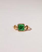 Emerald Moon Ring on light color background.