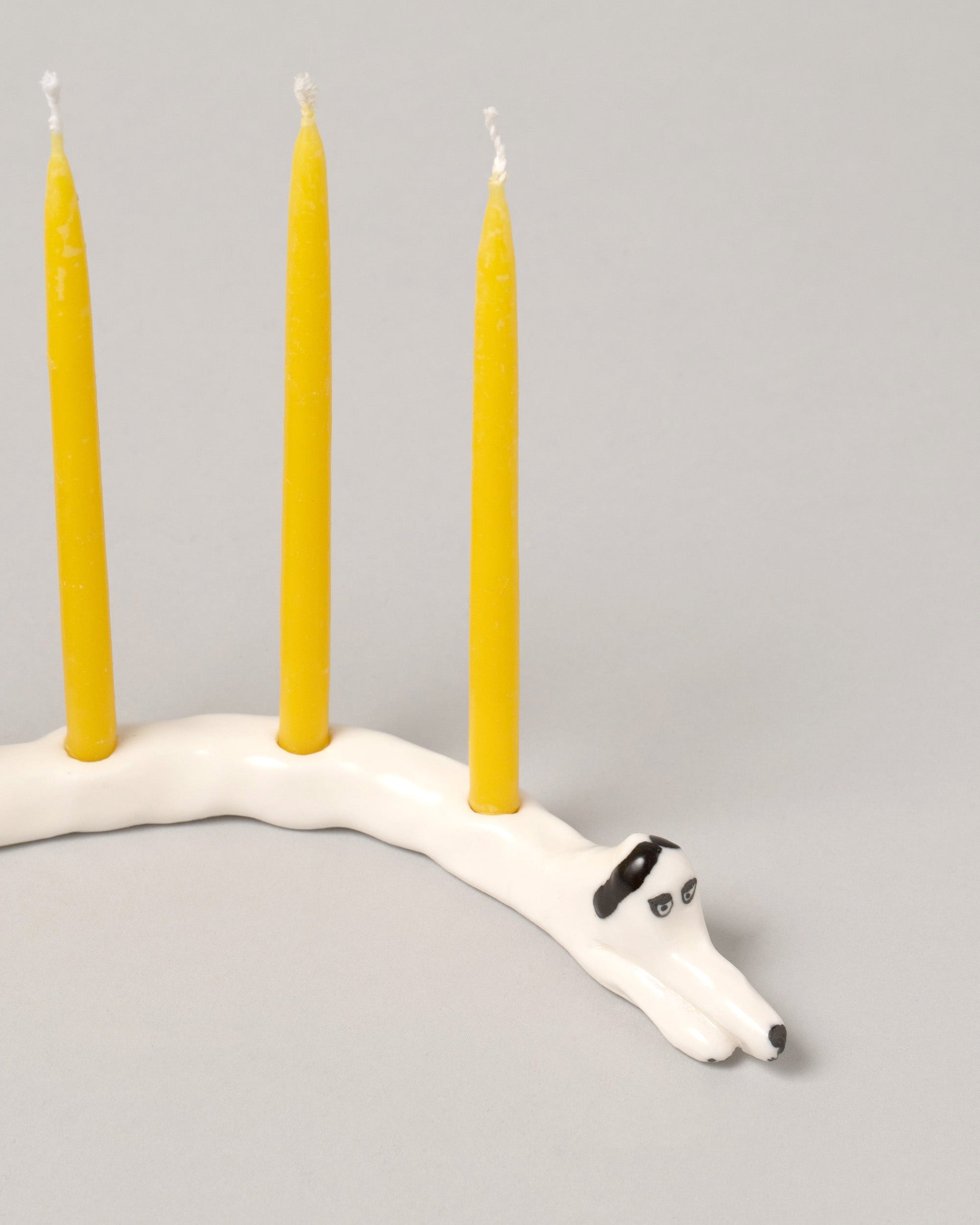 Closeup detail of the Eleonor Boström Black Ears Dog Menorah on light color background.