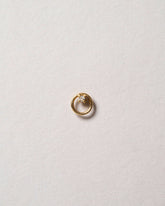 Gold White Diamond Full Moon Stud Earring Single on light color background.