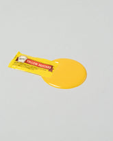 Spills Mustard Pack Condiment Pack on light color background.
