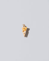 Swiss Cheese Charm on light color background.