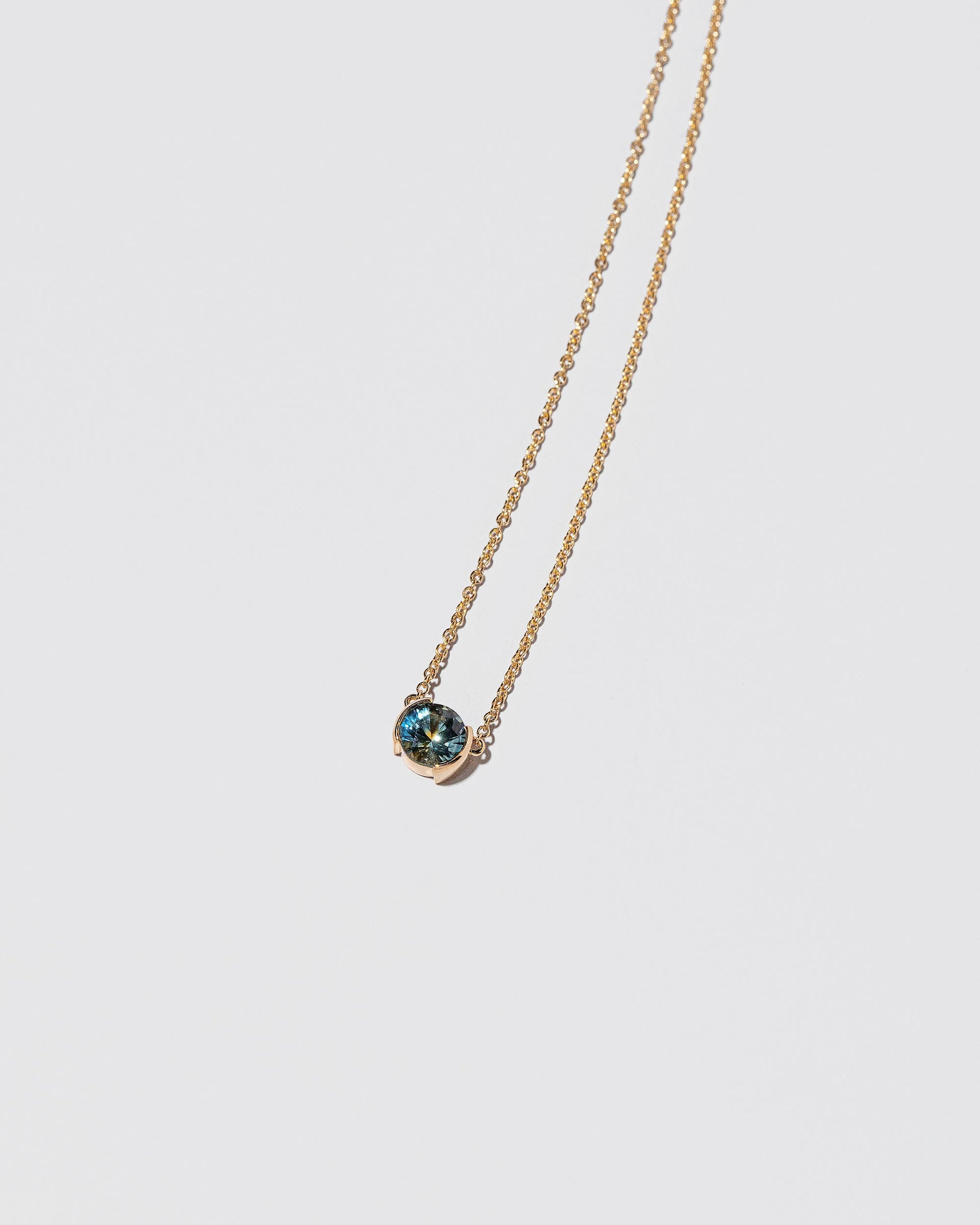 Multiplier Necklace on light color background.