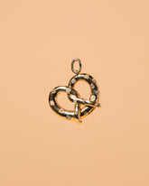 Salted Pretzel Charm on light color background.
