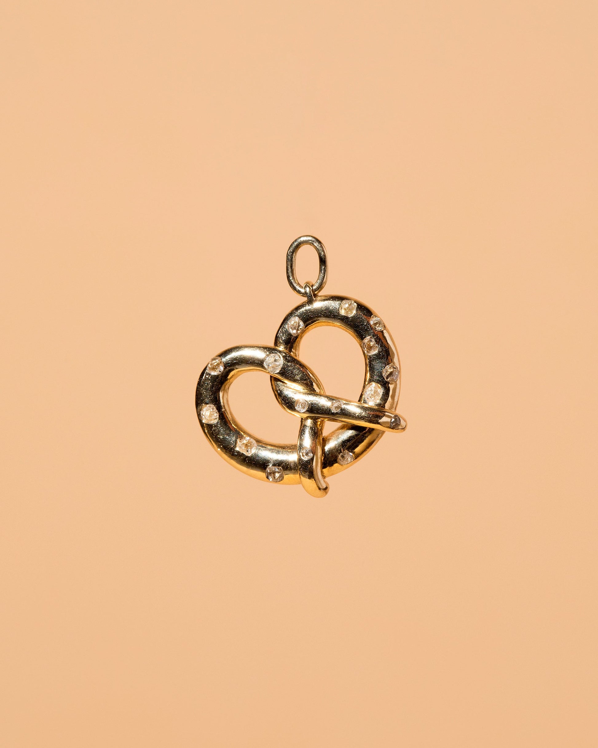 Salted Pretzel Charm on light color background.
