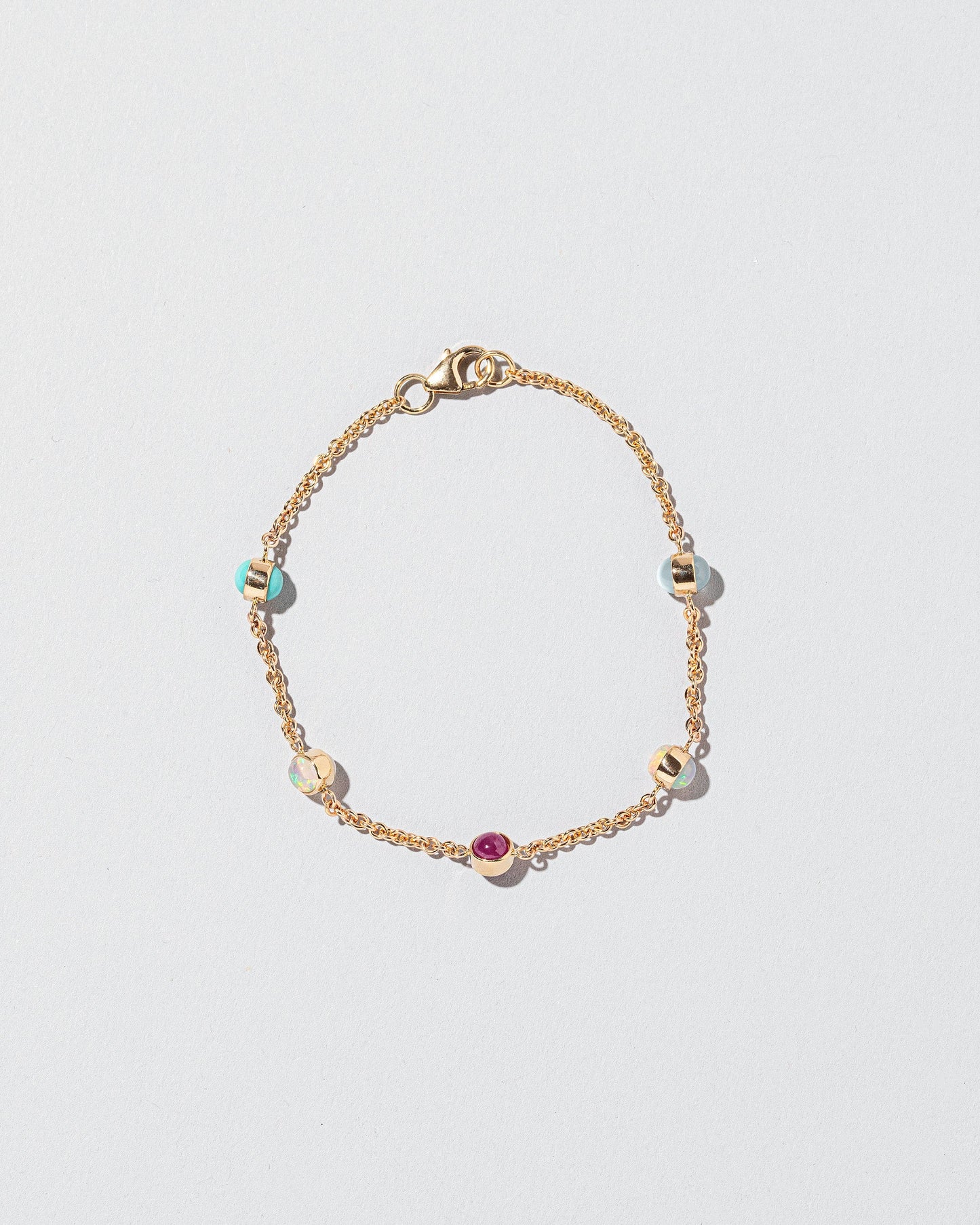 Birthstone Bracelet - Five Bezels on light color background.