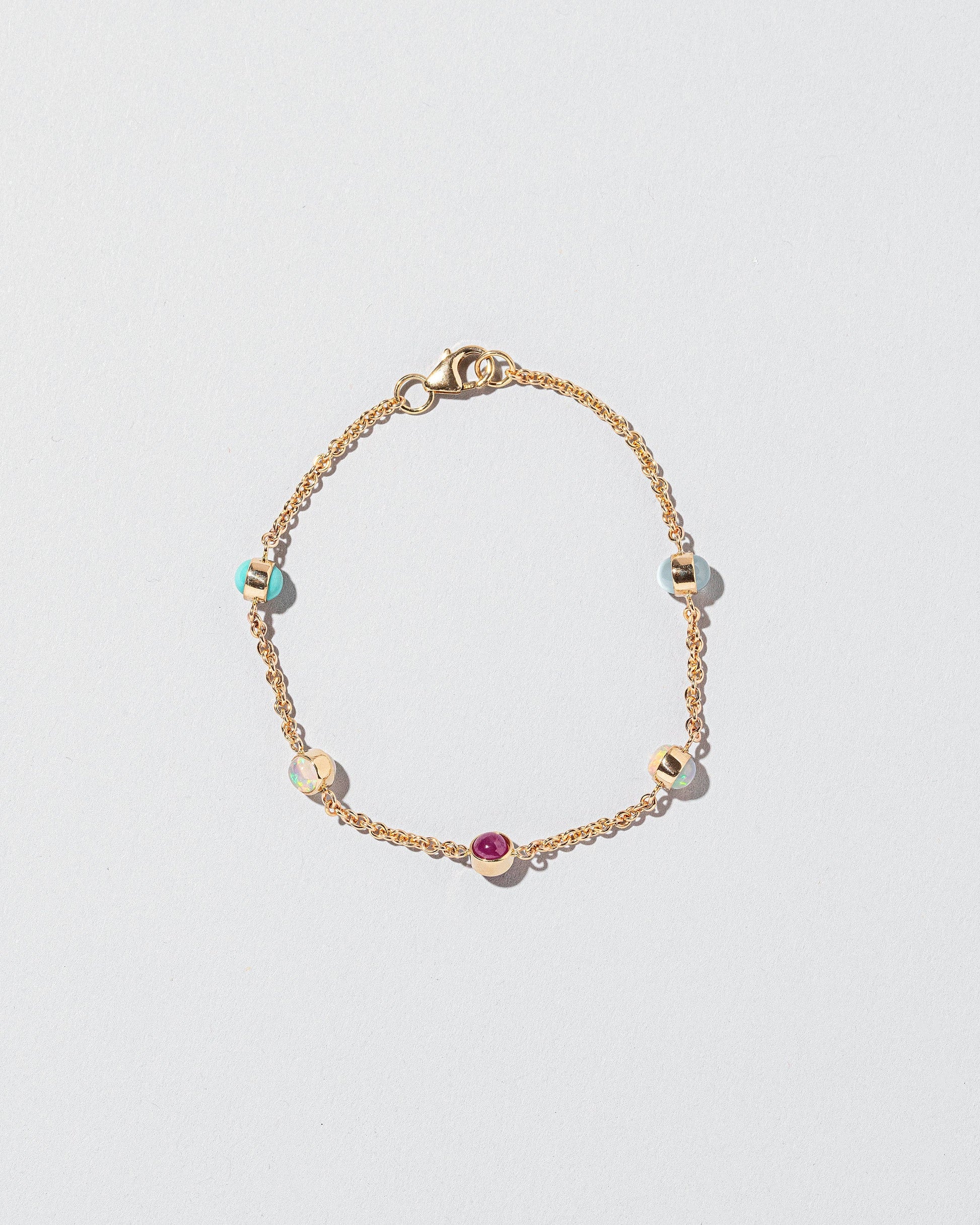 Birthstone Bracelet - Five Bezels on light color background.