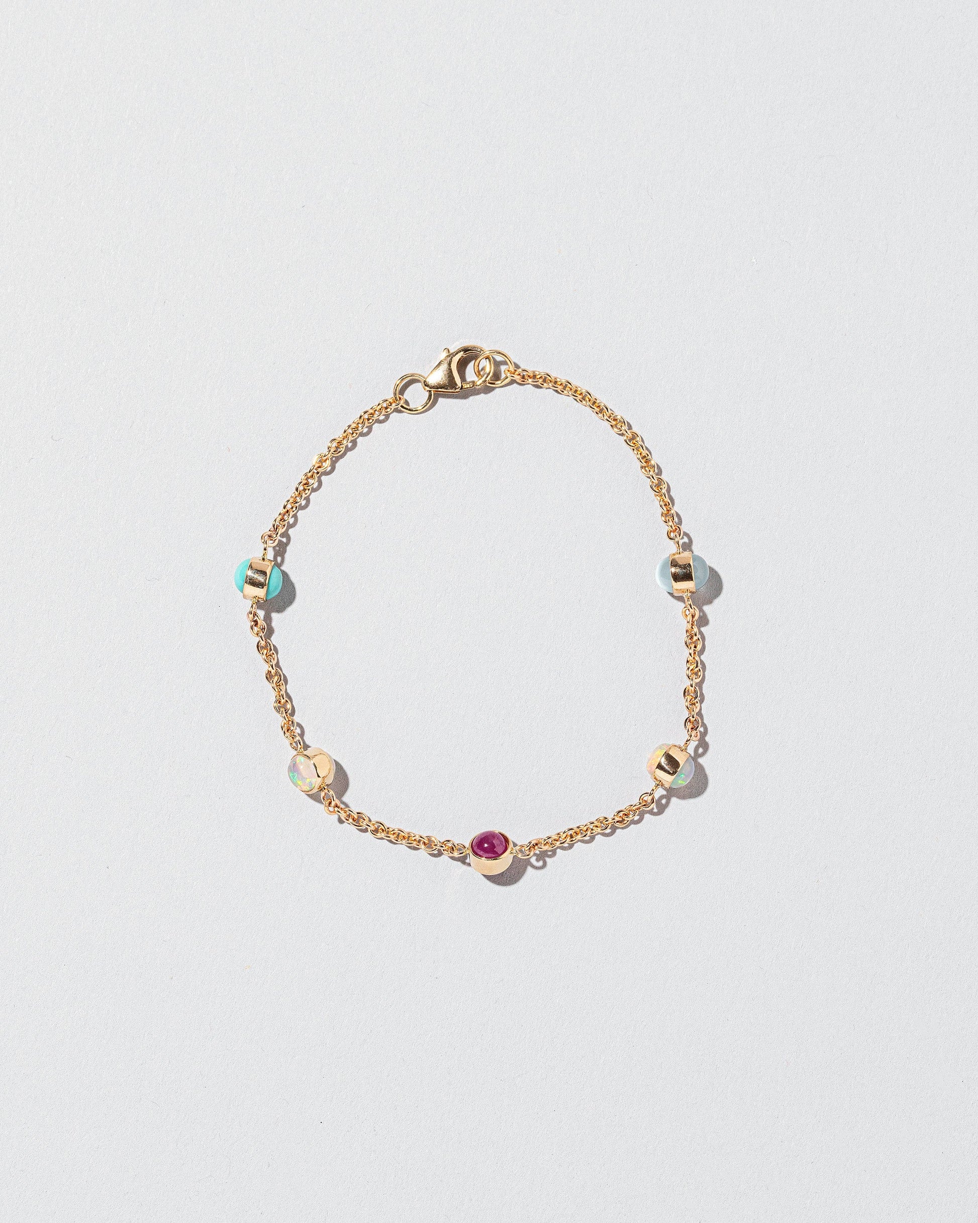  Birthstone Bracelet - Five Bezels on light color background.