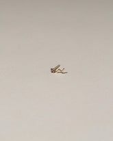 Lightning Single Stud on light color background.