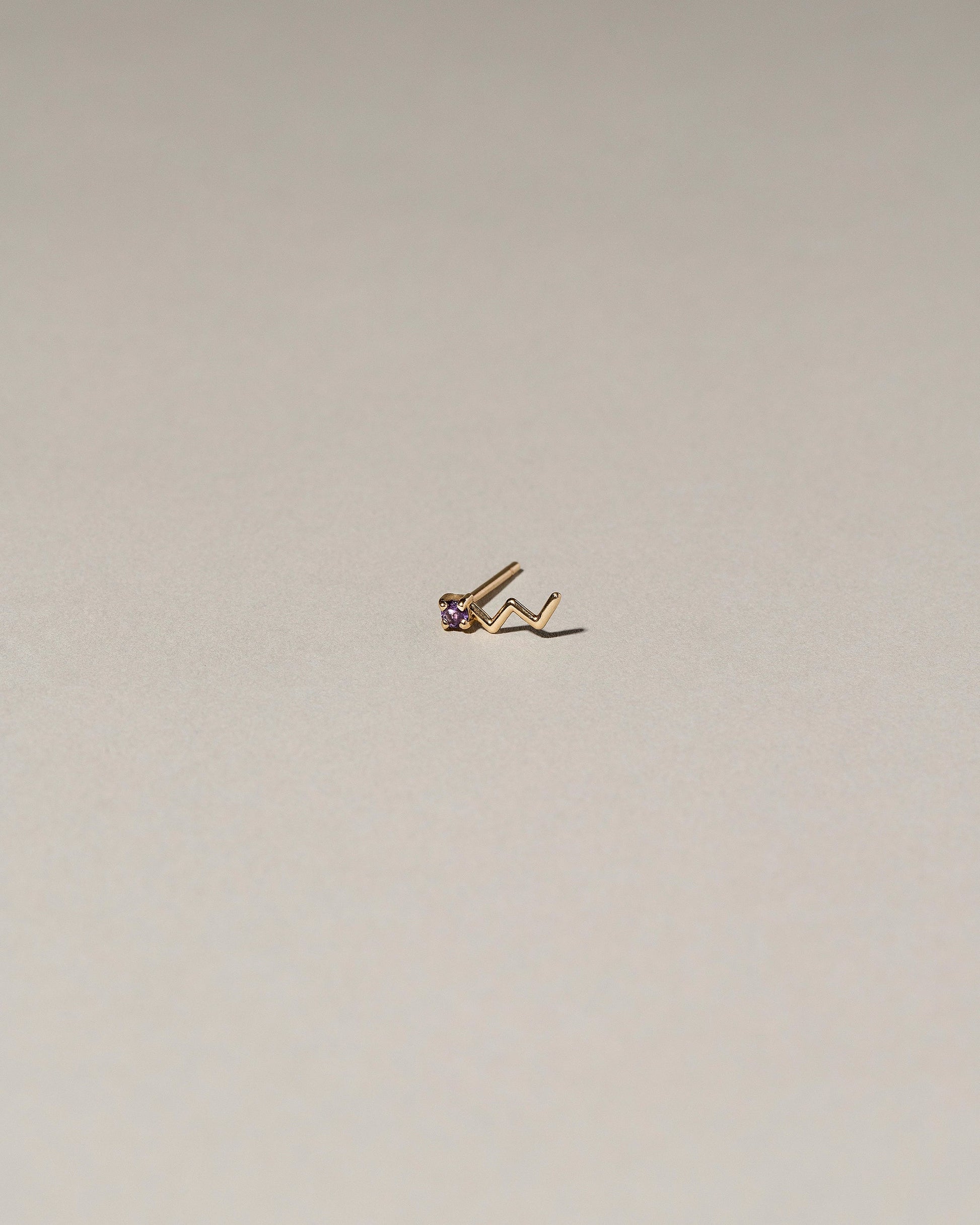 Lightning Single Stud on light color background.