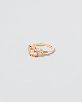 Qualia Ring on light color background.