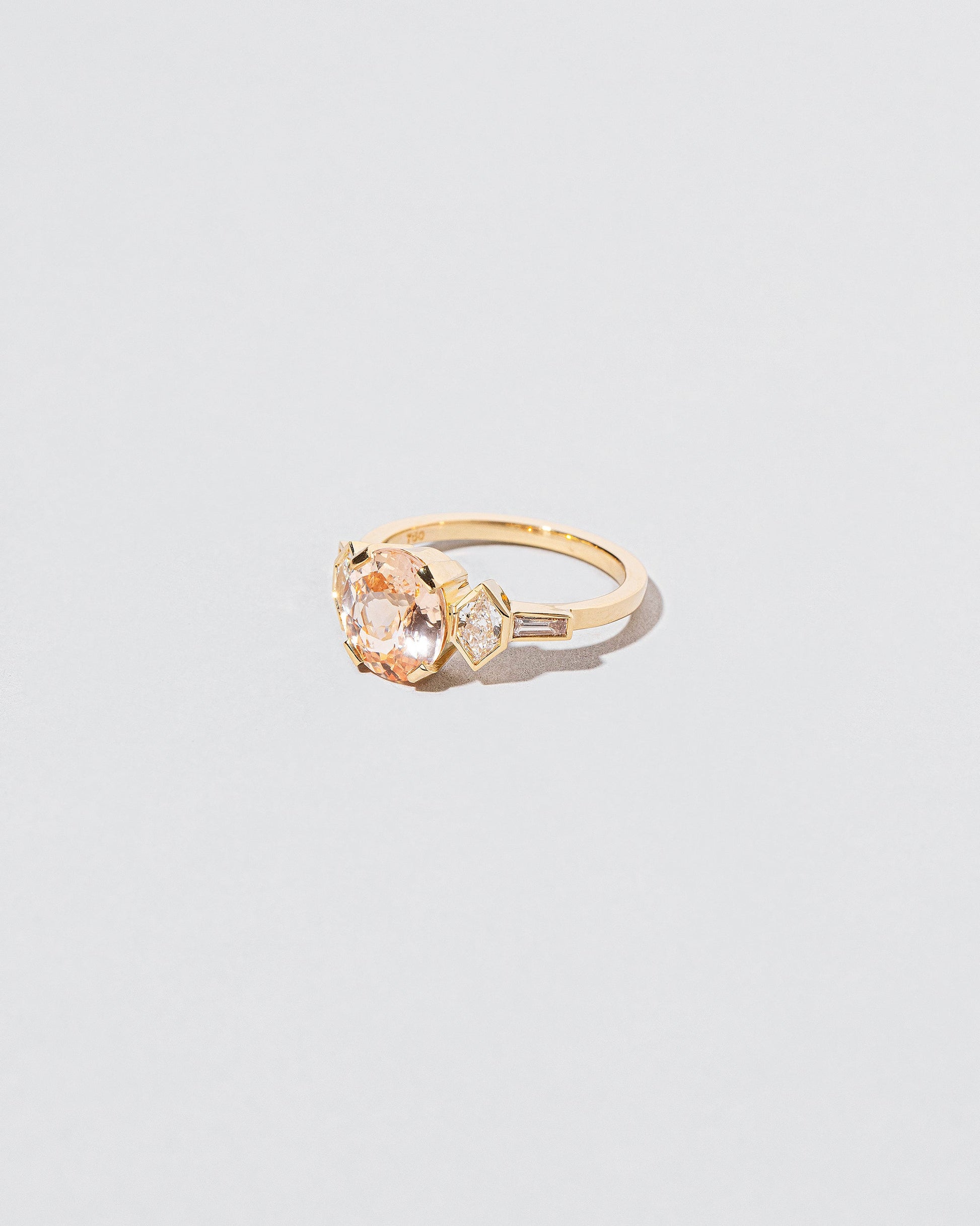 Qualia Ring on light color background.
