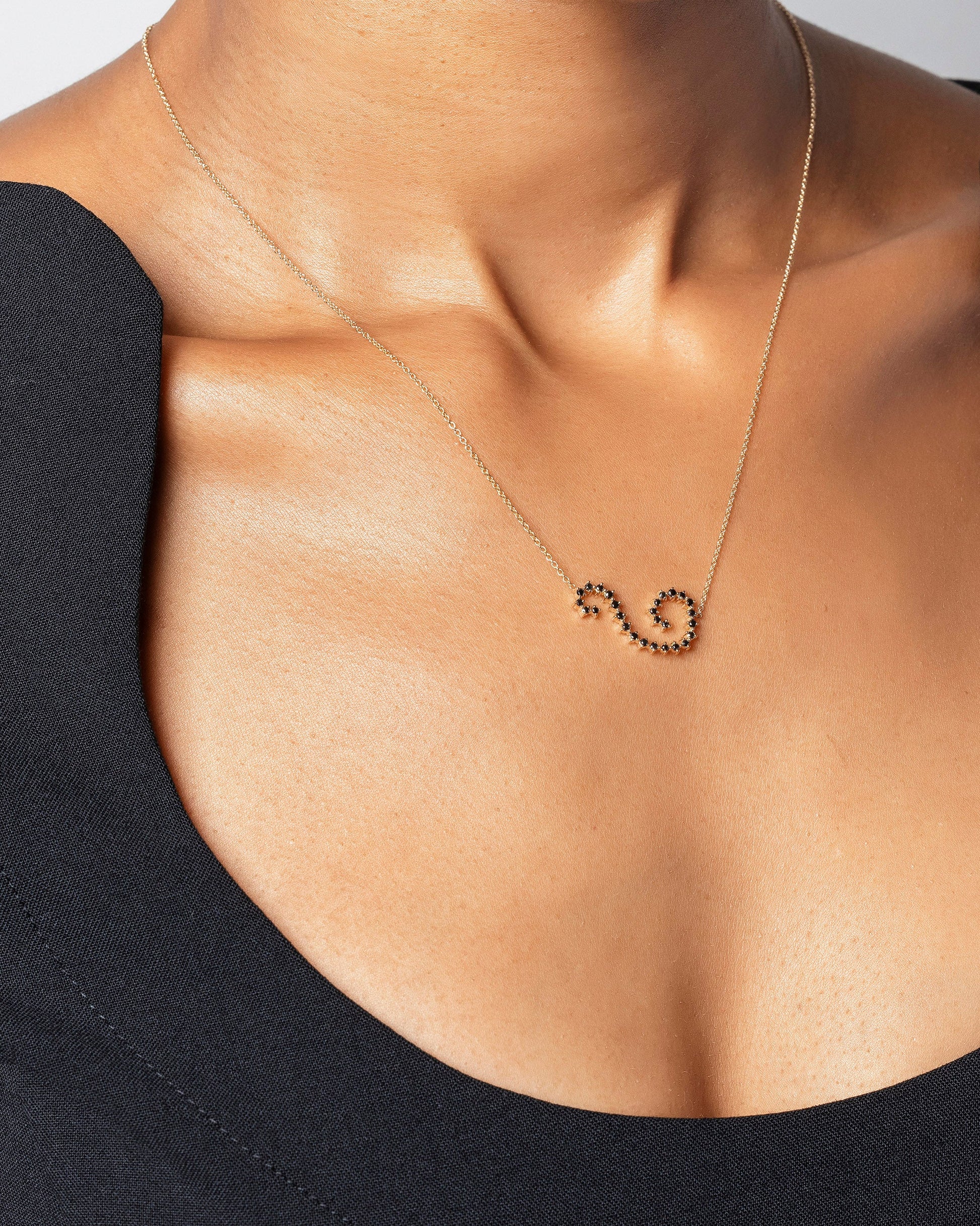 Black Diamond Symbol of Change Necklace on model.