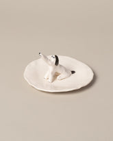 Closeup detail of the Eleonor Boström Dog Ring Dish on light color background.