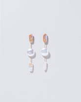 Theseus Earrings on light color background.