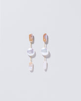  Theseus Earrings on light color background.